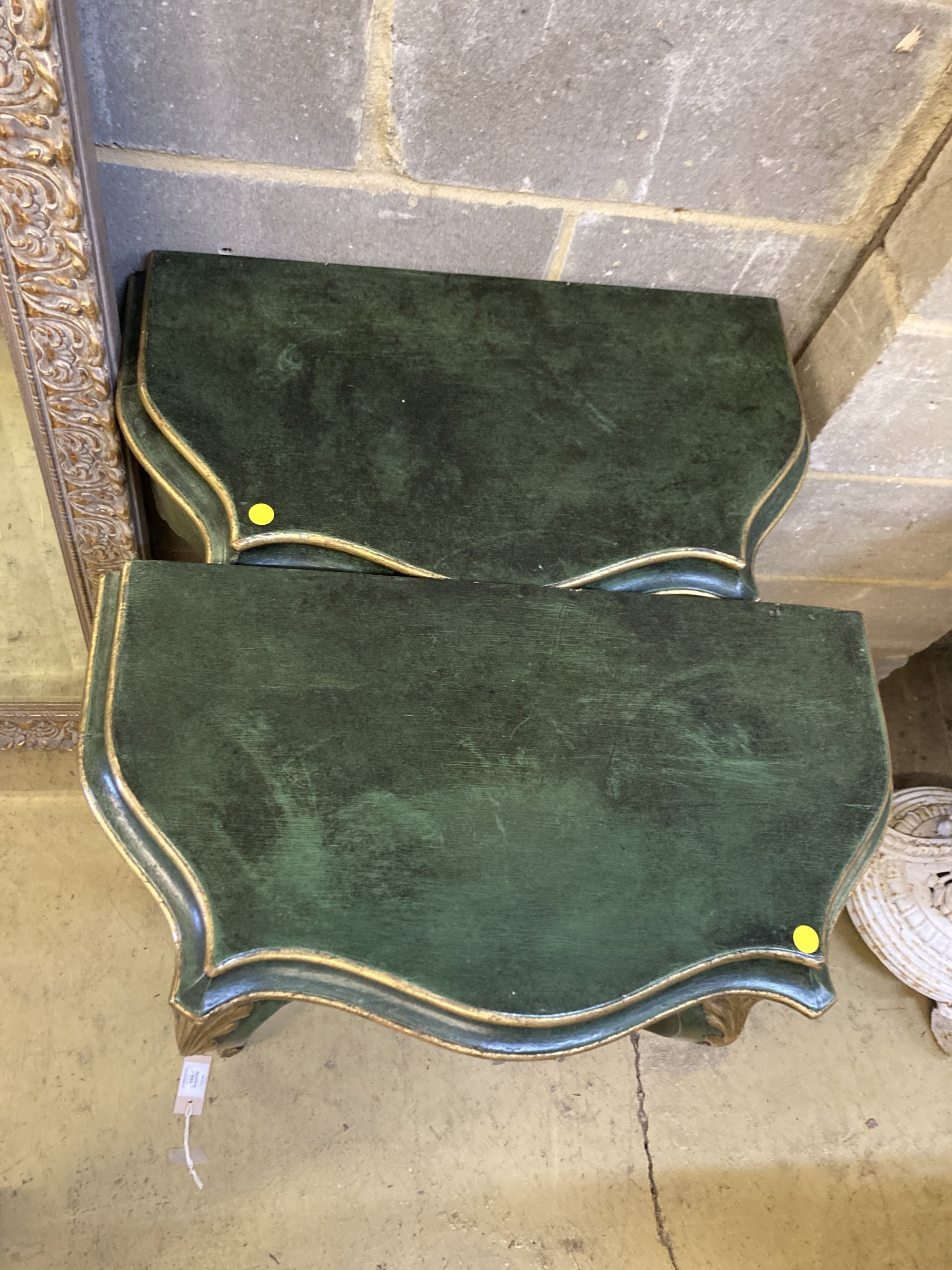 A pair of green painted and gilt console tables, width 65cm, depth 35cm, height 81cm